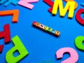 Selective focus.Colorful dice with word CONCEPT on blue background.Shot were noise and film grain. Royalty Free Stock Photo