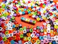 Selective focus.Colorful dice with word PRICE on red background.Shot were noise and film grain. Royalty Free Stock Photo