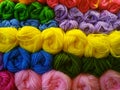 The colorful yarn balls are orderly arranged.