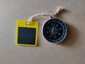 Selective focus.Compass and copy and text space wooden board with wooden background. Shot were noise and film grain. Royalty Free Stock Photo