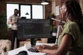 Selective focus on computer screen with programming language text of programmer working remote Royalty Free Stock Photo