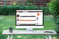 selective focus of computer with soundcloud website at table