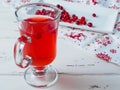 Selective focus on cranberries in a fresh drink in a glass cup