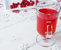 Selective focus on cranberries in a fresh drink in a glass cup