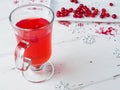 Selective focus on cranberries in a fresh drink in a glass cup