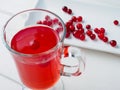 Selective focus on cranberries in a fresh drink in a glass cup