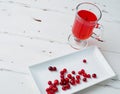 Selective focus on cranberries in a fresh drink in a glass cup