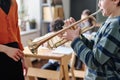 Kid Playing Brass Instrument During Music Class Royalty Free Stock Photo