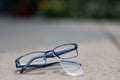 Selective focus on damaged glasses with scratched lens popped out