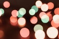 defocused bright shiny multicolored christmas lights with backdrops