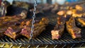 Pork ribs grilled on metal lattice outside Royalty Free Stock Photo
