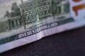 Selective focus on detail of 100 dollars banknote. Close up macro detail of money banknotes, dollars isolated. World money concept Royalty Free Stock Photo