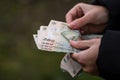 Selective focus on detail of LEI banknotes. Counting or giving Romanian LEI banknotes. World money concept, inflation and economy