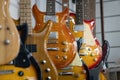 Selective focus of different electric guitars in a row hanging in a modern musical shop Royalty Free Stock Photo