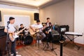 selective focus of a digital camera recording a video of a band group of young people performing Royalty Free Stock Photo