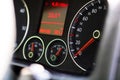 Selective focus on digital display of car isolated. Car speedometer, dashboard, tachometer and temperature gauge