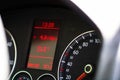 Selective focus on digital display of car isolated. Car speedometer, dashboard, tachometer and temperature gauge