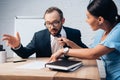 Focus of displeased client holding tie