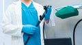 Selective focus on doctor's hands holding an endoscope. Royalty Free Stock Photo