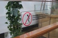 Don\'t lean (Dilarang Bersandar) prohibition on a glass barrier in a shopping center in Indonesia