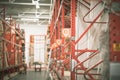 Selective focus door windows moulding millwork parts on metal rack shelving with bay number, lumber cart at home improvement