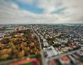 Selective focus drone shot of residential buildings and parks in a city