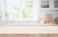 Selective focus.End grain wood table counter top on blur kitchen in morning window background Royalty Free Stock Photo