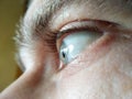 Selective focus eye of caucasian man. Macroshot texture of male skin surface, wrinkles, retina, eyelashes, eyebrows. ÃÂ¡oncept of