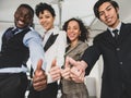 Selective focus on face and smile. Businessmen and businesswomen Ethnic diversity, thumbs up, showing excellence and teamwork to