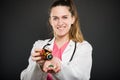 Selective focus of female doctor spilling bottle of pills Royalty Free Stock Photo