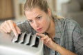 selective focus female worker repairing air conditioner Royalty Free Stock Photo