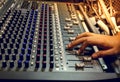 Selective focus finger sound tuning of sound mixer Royalty Free Stock Photo