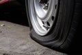 Selective focus flat tire of old car park on the street Royalty Free Stock Photo