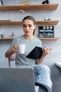 Focus of focused freelancer with cup