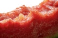 Selective focus fresh Sweet watermelon on white background, soft focus of bite mark inside of watermelon, red surface with juicy