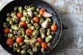 Brussels sprouts with vegetables and herbs in a pan. Cooking Brussels sprouts. Vegan food. Selective focus. Royalty Free Stock Photo