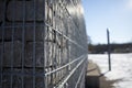 Selective focus of gabion wall caged stones textured background Royalty Free Stock Photo