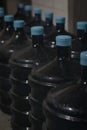 Selective Focus Gallons or plastic bottles of purified drinking water on pallets Royalty Free Stock Photo