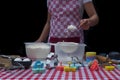 Selective focus. Girl  sifting flour adding baking ingredients. Home bakery Royalty Free Stock Photo