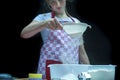 Selective focus. Girl  sifting flour adding baking ingredients. Home bakery Royalty Free Stock Photo