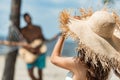 selective focus of girl in straw hat and man playing acoustic guitar Royalty Free Stock Photo