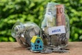 Selective focus on glass jar bottle labeled as house with full o Royalty Free Stock Photo