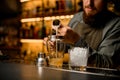 selective focus on glassy shaker into which pours drink from jigger Royalty Free Stock Photo