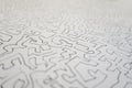 Selective focus of a graphite line drawing of a maze like art pa