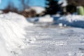 Selective focus ground level view of snow blown sidewalk section with path continuing. Royalty Free Stock Photo