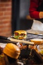 Process of cooking of tasty burger in burger bar Royalty Free Stock Photo