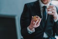 Selective focus of the hand holding ball of rubber bands