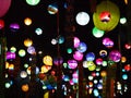 Selective focus on hand painted paper ball lanterns along main entrance street of KHON KAEN university in KHONKAEN province, THAIL