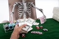 Selective focus at hand pay bets to Gambler skeleton on casino t