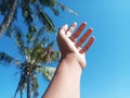 Selective Focus of A Hand Reaching Out Towards the Sky with Blurred Sky Background Royalty Free Stock Photo